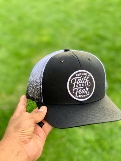 Choose faith over fear black and white trucker hat